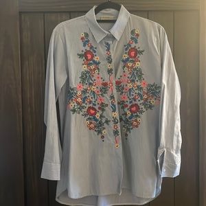 Woman’s embroidered striped blouse.